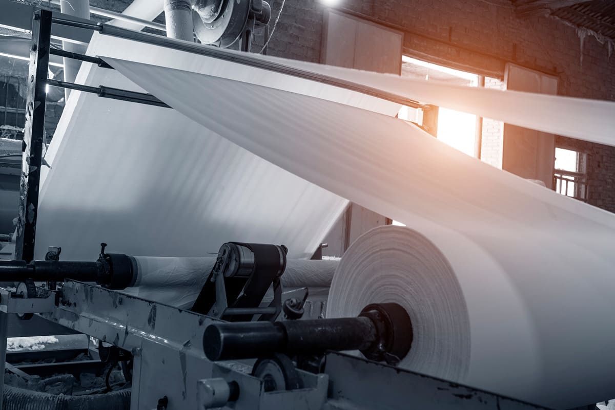 Close up paper roll on machinery